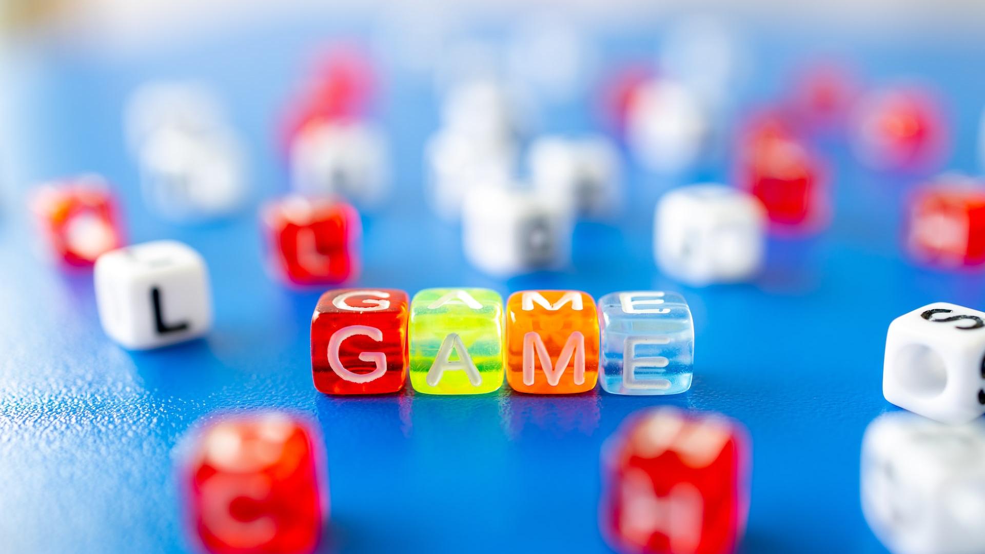 red white yellow and blue plastic dice